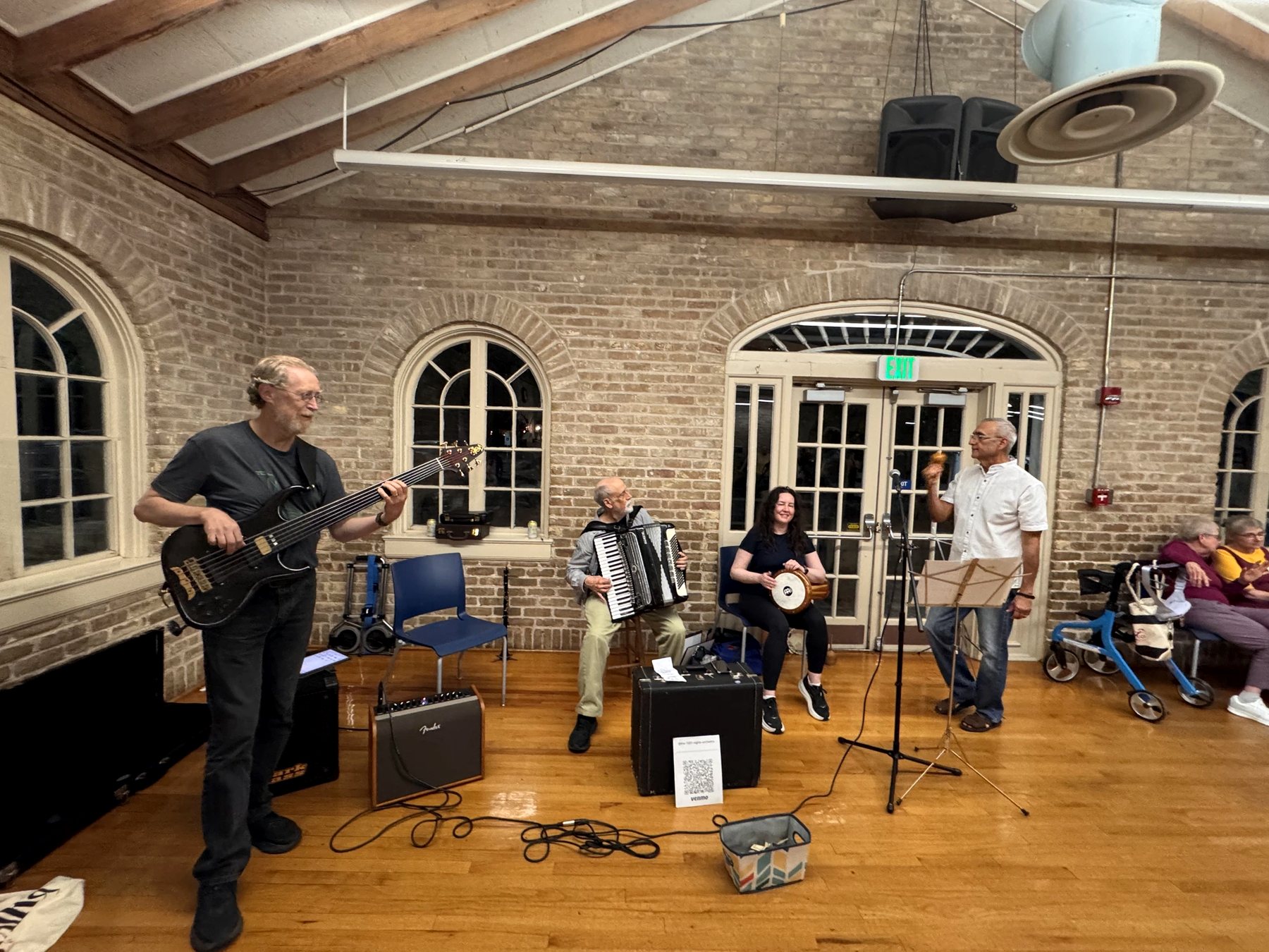 Victor on fretless bass, Don on accordion, Sonique on darbuka and Javier singing beneath the brick arches of Hancock Recreation Center